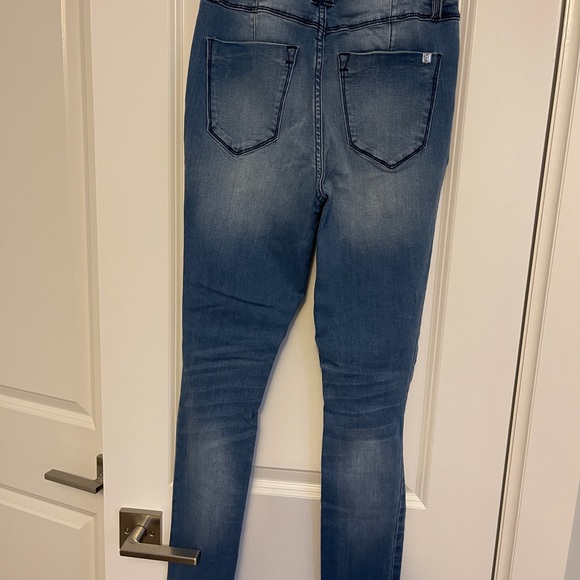 Skinny jeans with rips by Bebe - Picture 3 of 6